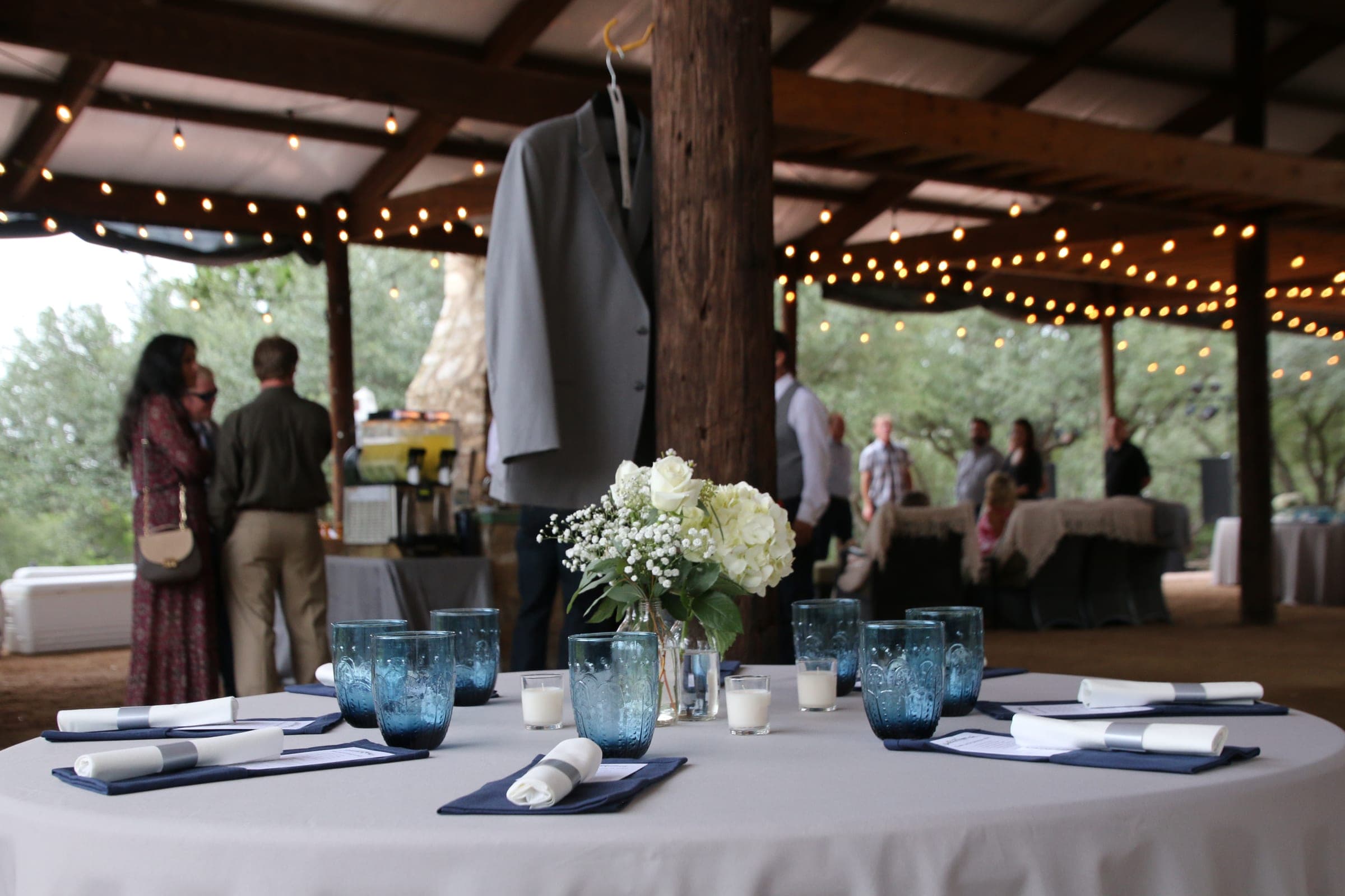 Pavilion interior set for the reception, string lights overhead